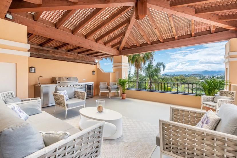 Renovated duplex penthouse in gated complex with communal gardens and 24h security