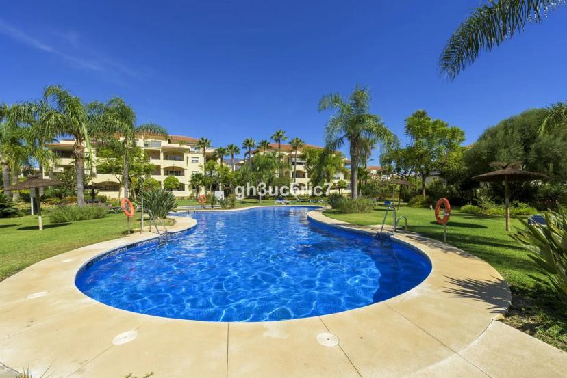Ground floor apartment in La Cala Hills with garden and pool views